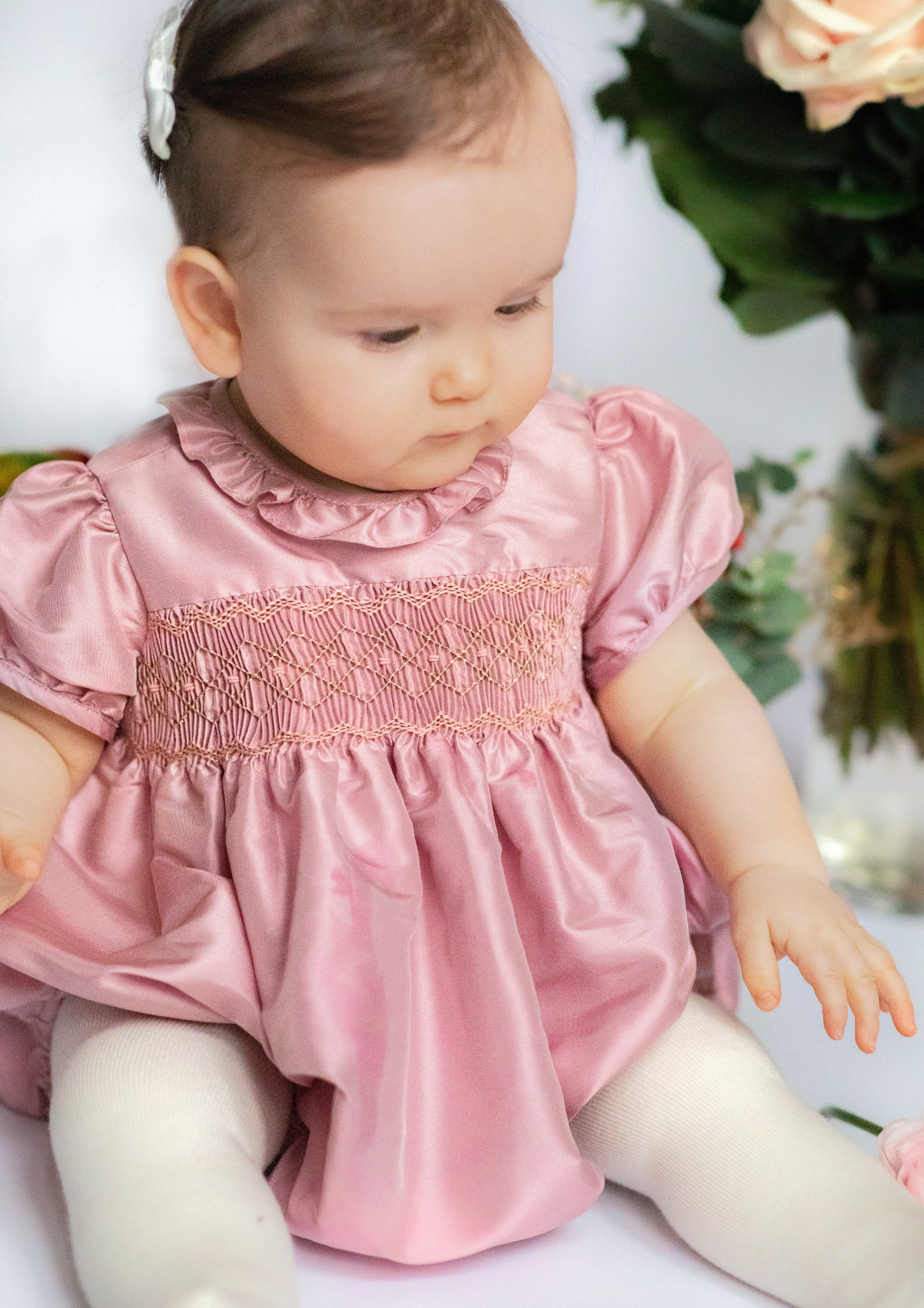 Close up to Astrid Pink Silk Smocked Baby Bubble