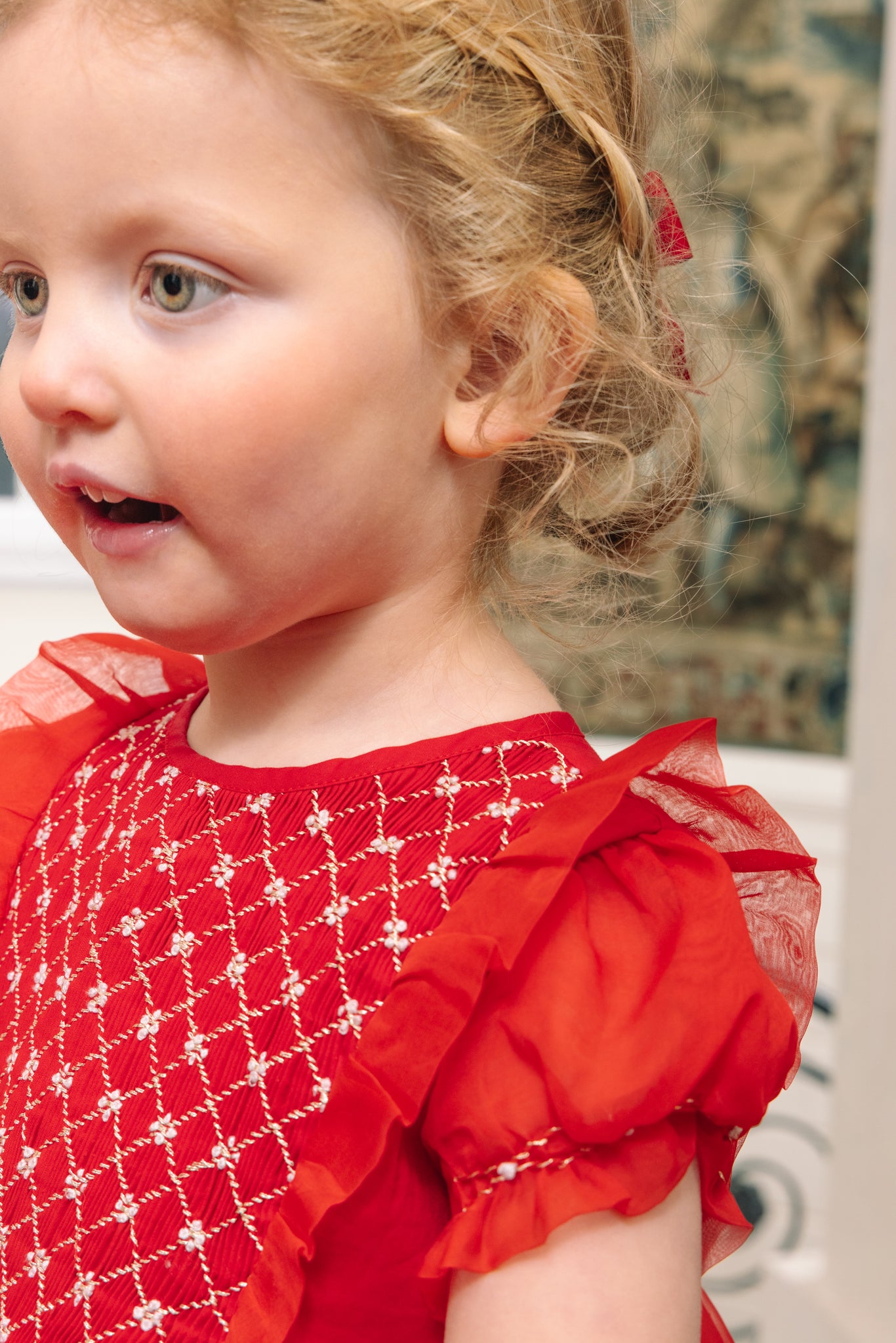 Close-up of smocking details on Camelia Red Cotton Smocked Dress