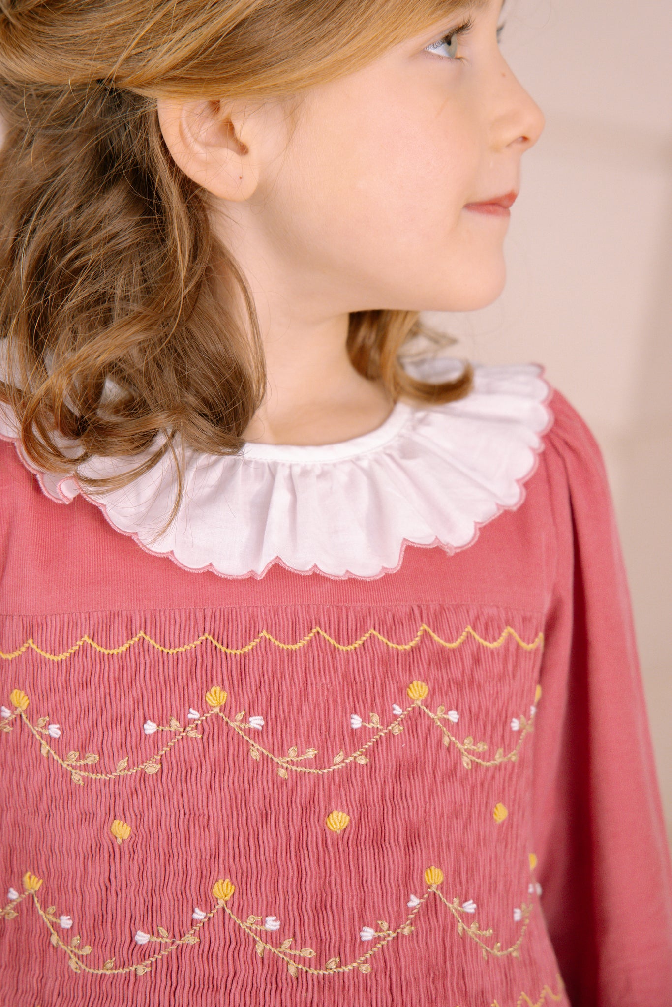 Close-up of collar and smocking details on Chiara Pink Smocked Dress
