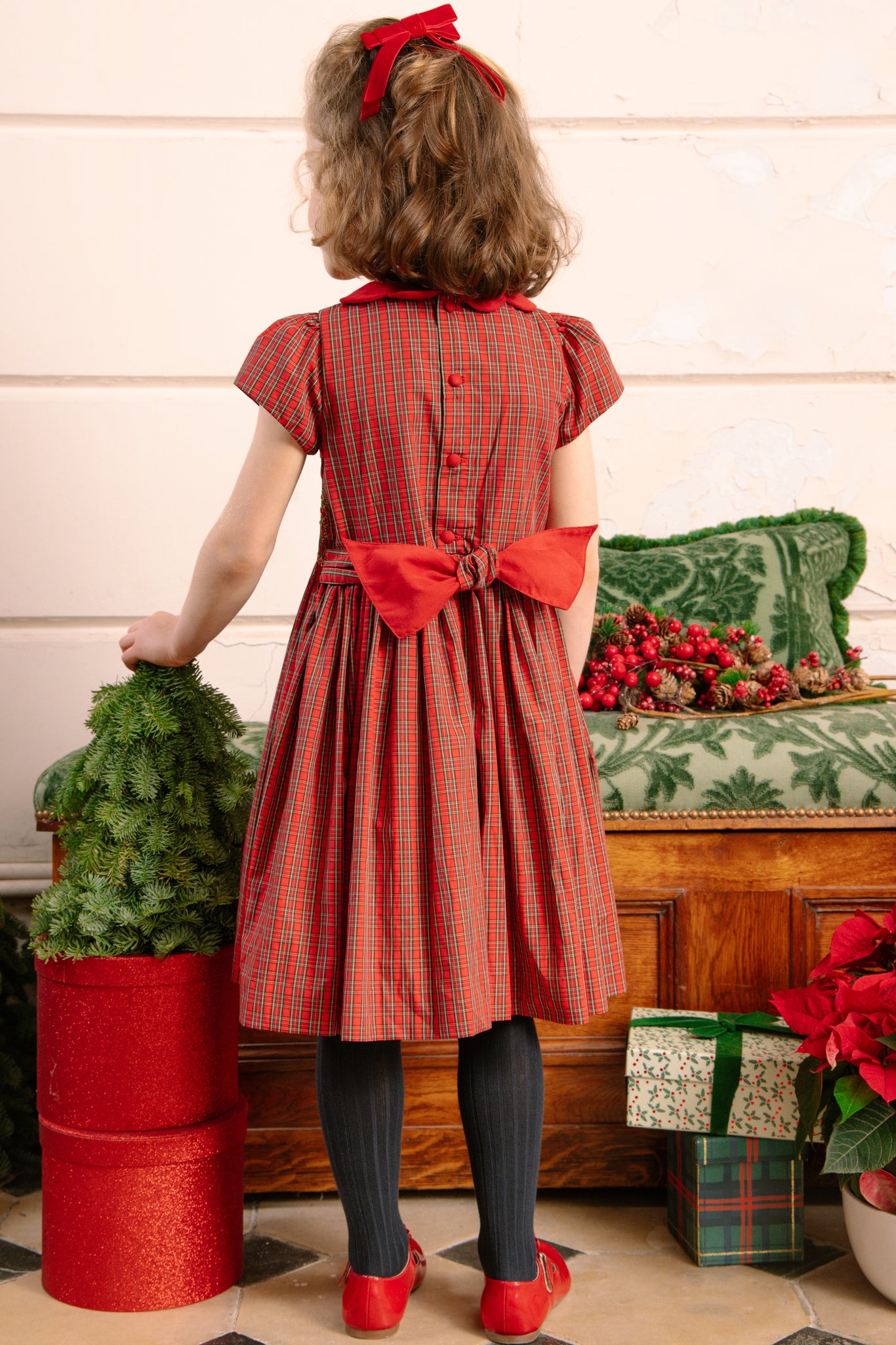 Back of girl wearing Marguerite Red Tartan Smocked Dress