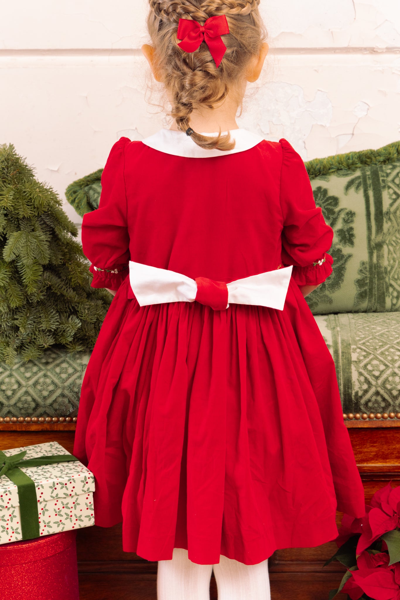 Back of girl wearing Olympe Red Holiday Smocked Dress
