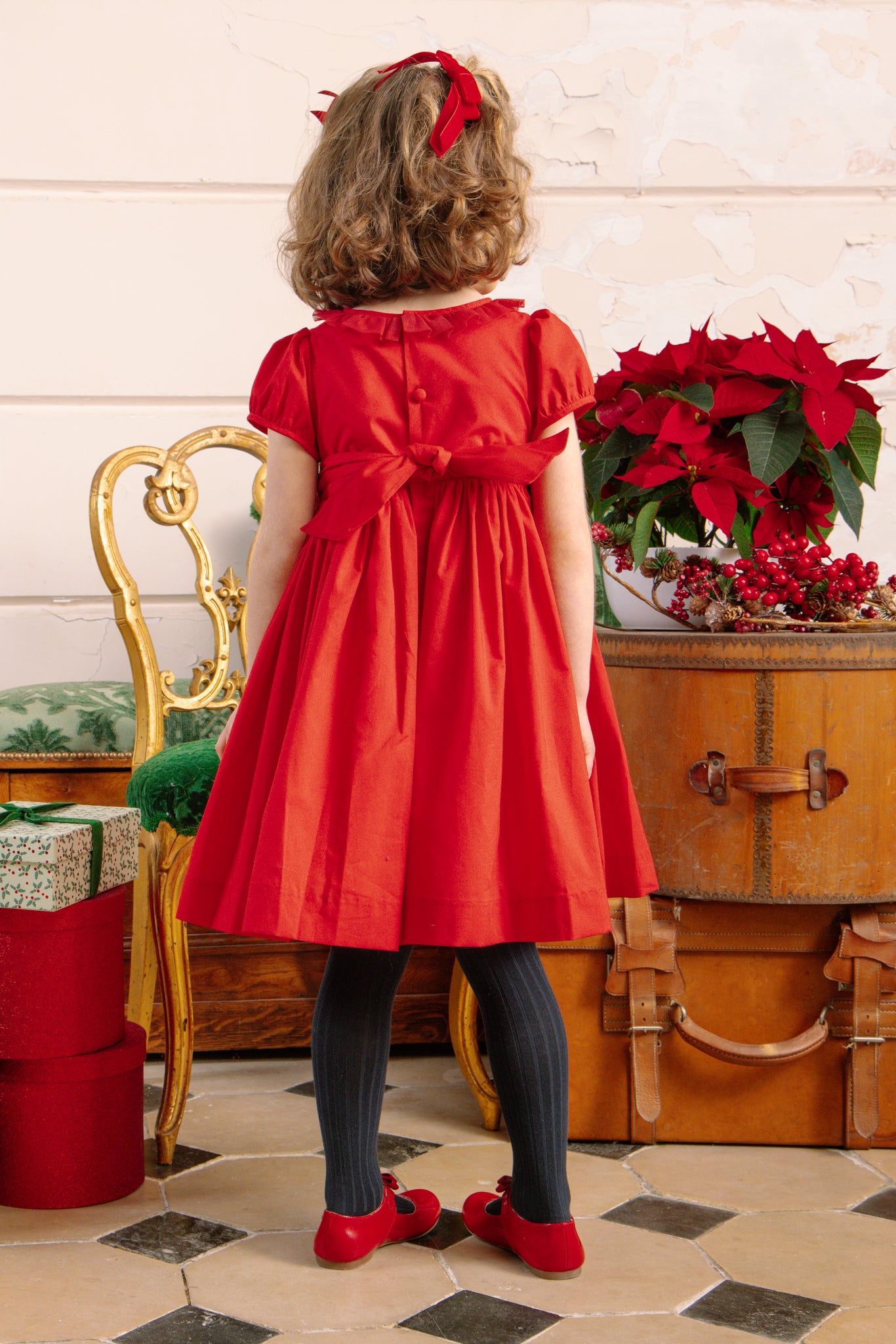 Back of girl wearing Sofia Red Smocked Dress