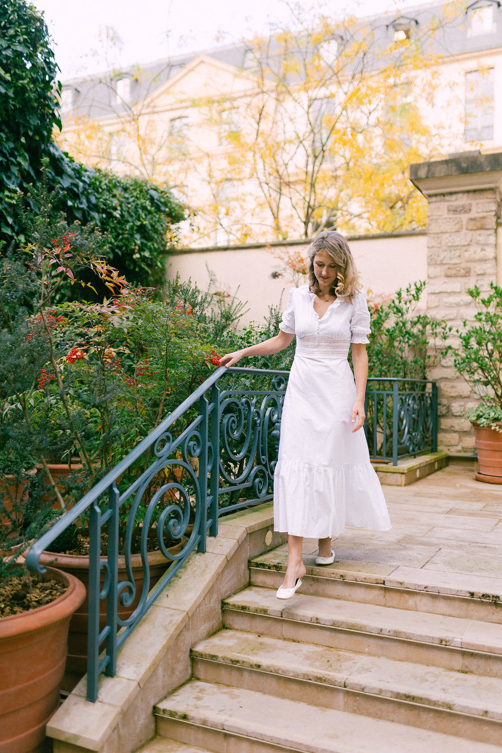 White cotton women's midi-maxi dress with smocked waist and balloon
sleeves