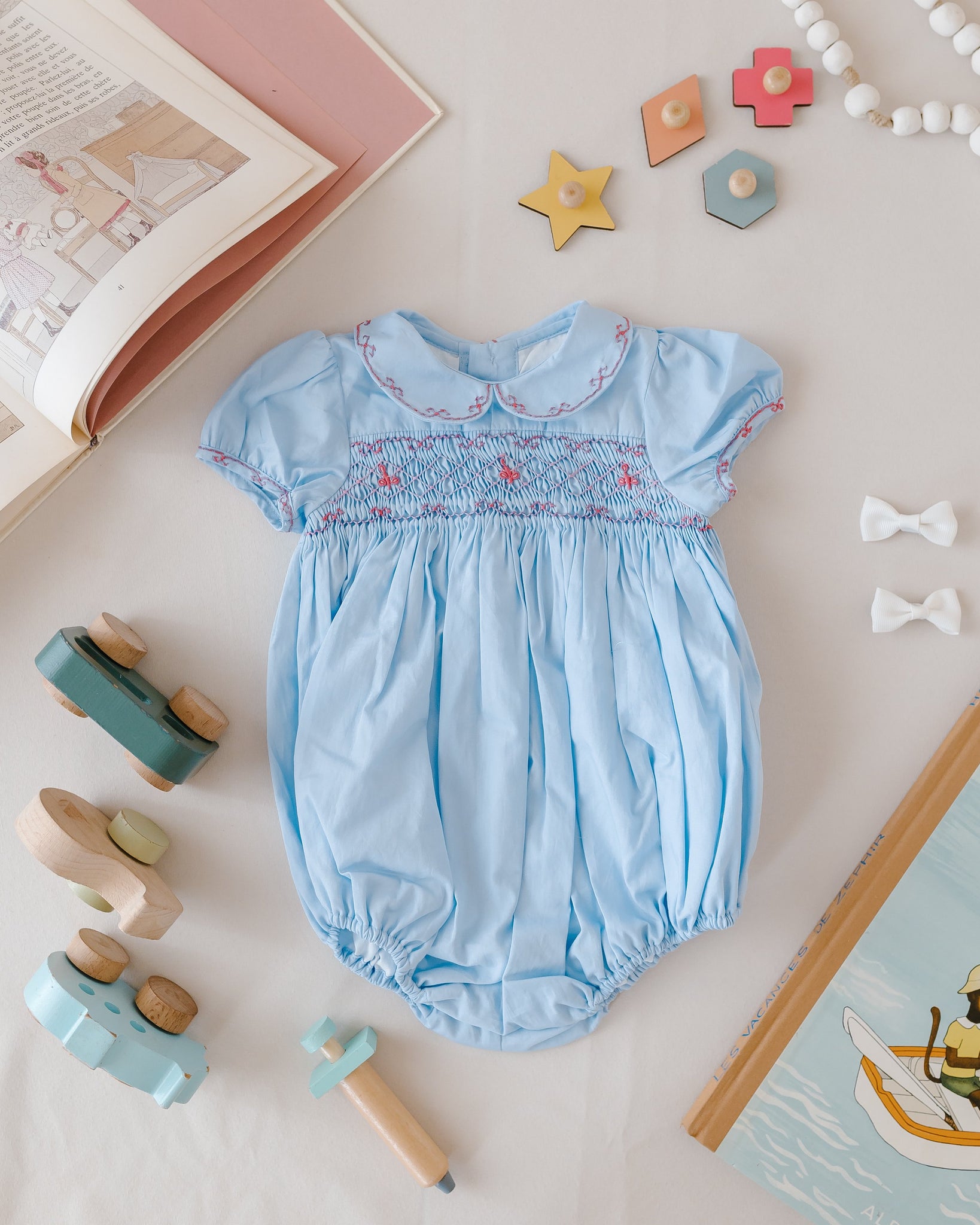 Princess Charlotte Sky Blue Smocked Baby Romper